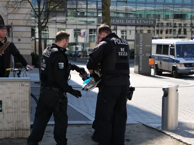 The image shows three police officers standing next to each other on a city street. Two of the...