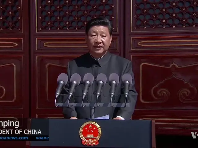The image shows Xi Jinping, the President of China, standing in front of a podium with microphones...