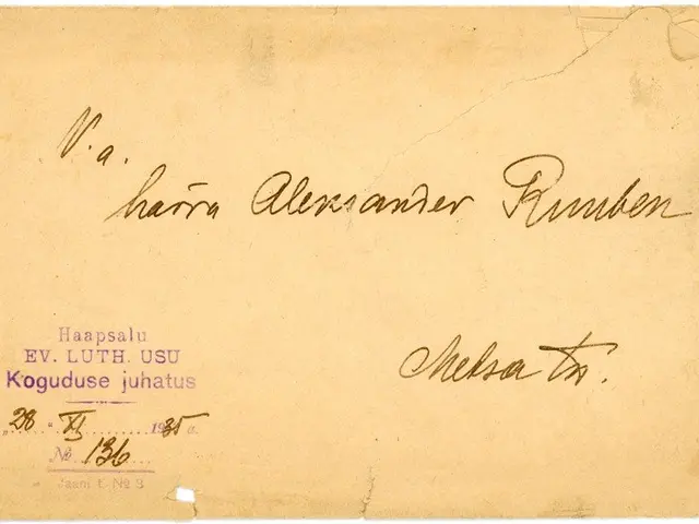 The image shows an old envelope with a handwritten message on it. The envelope is yellowed with age...