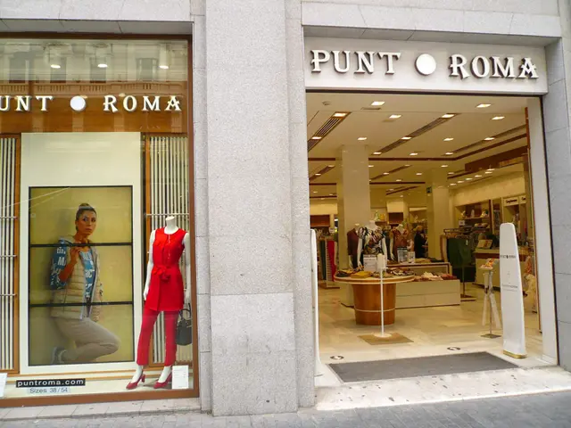 The image shows a Punt Roma store in Milan, Italy, with mannequins wearing dresses in the window,...