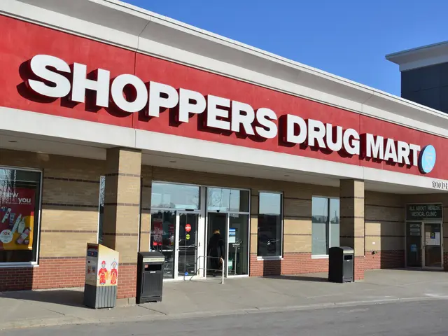 The image shows a shopper's drug mart store front with a sign that reads "Shoppers Drug Mart" and a...
