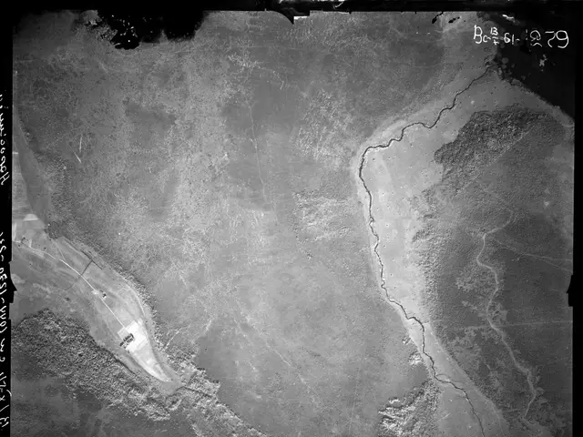 The image shows a black and white photo of a large body of water, likely a riverbed, with text on...