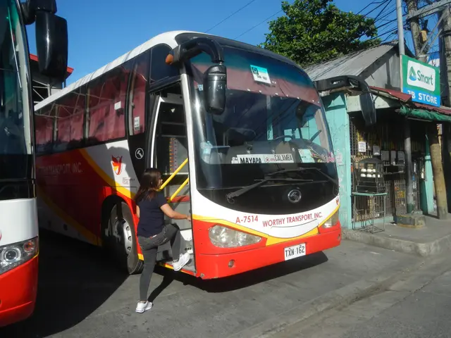 The image shows a woman getting off a red and white bus at a bus stop. She is wearing a blue...