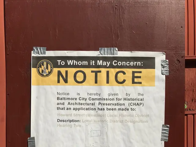 The image shows a notice posted on the side of a building that reads "To Whom It May Concern". The...