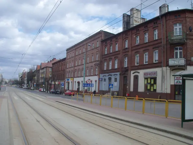 The image shows a city street with a tram on the tracks, surrounded by buildings with windows, sign...