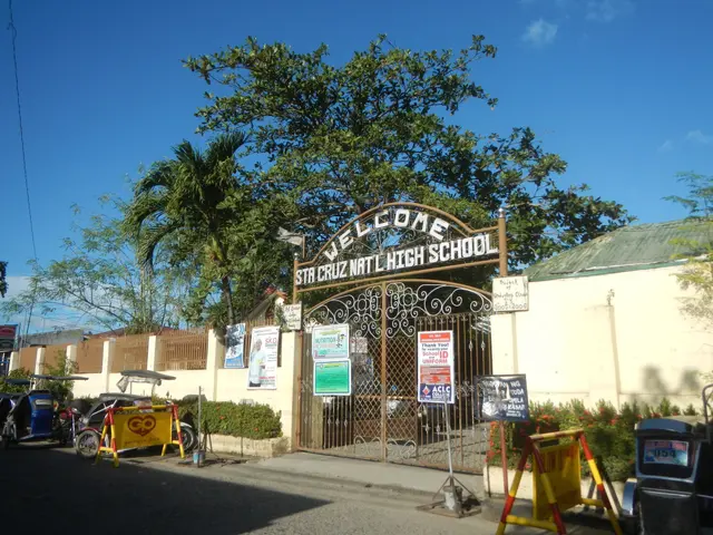 The image shows the entrance to a school with a sign that reads "Welcome" in front of it. There are...