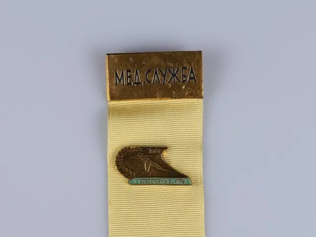 The image shows a yellow ribbon with a gold medal on it, which is the Order of the Patriotic War of...