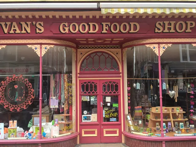 The image shows a van's good food shop in London, England. It is a building with a door and...
