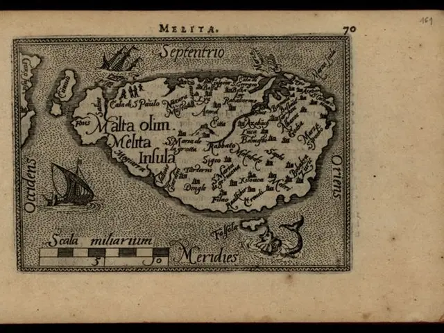 The image shows an old book with a map of the island of Malta on it. The map is detailed and shows...