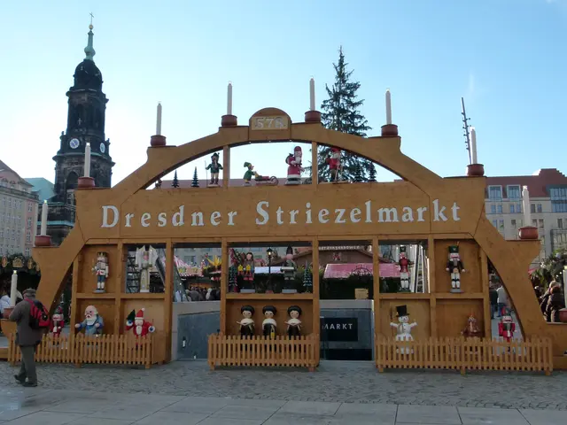 The image shows a bustling Christmas market in Dresden, Germany. There are many people walking...