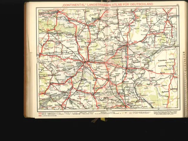 The image shows an open book with a map of Germany on it, set against a black background. The map...