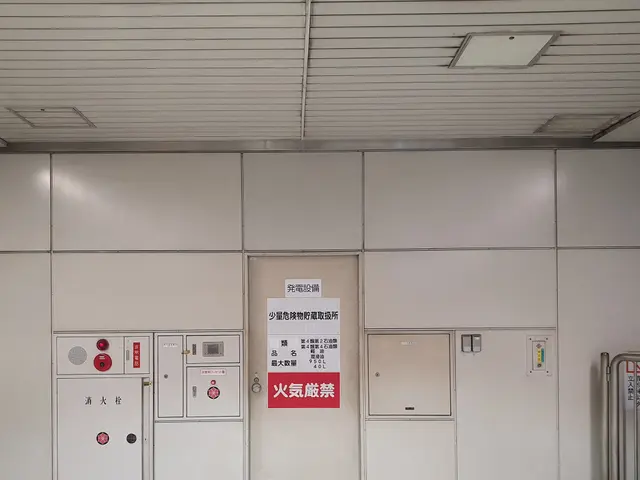 The image shows an elevator in a building with a sign on the wall. The floor is visible at the...