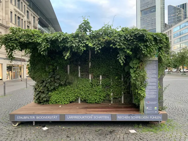 The image shows a green building with ivy growing on the side of it, surrounded by trees, vehicles,...