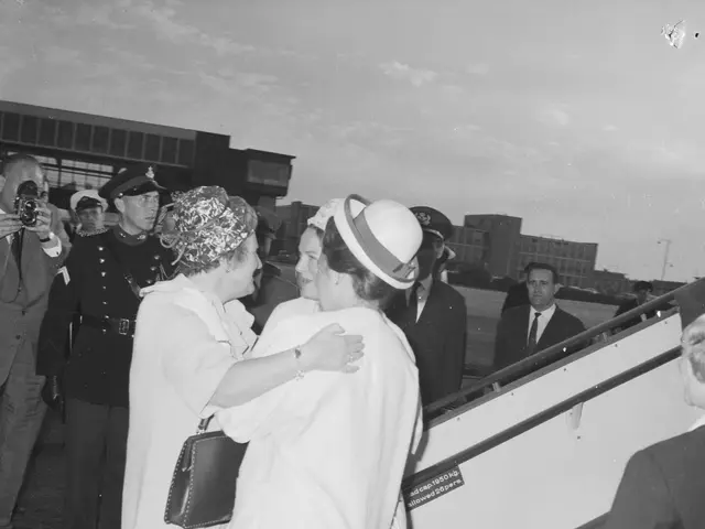 The image shows Queen Elizabeth II and Prince Philip, Duke of Edinburgh, arriving at Heathrow...