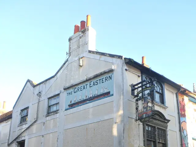The image shows the Great Eastern Pub in London, England. It is a building with windows and doors,...
